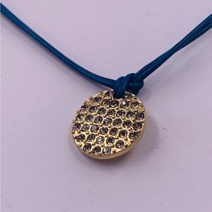 Lia Sophia Spotlight Crystal
Pave Coin Gold Tone Pendant Blue
Cord Necklace